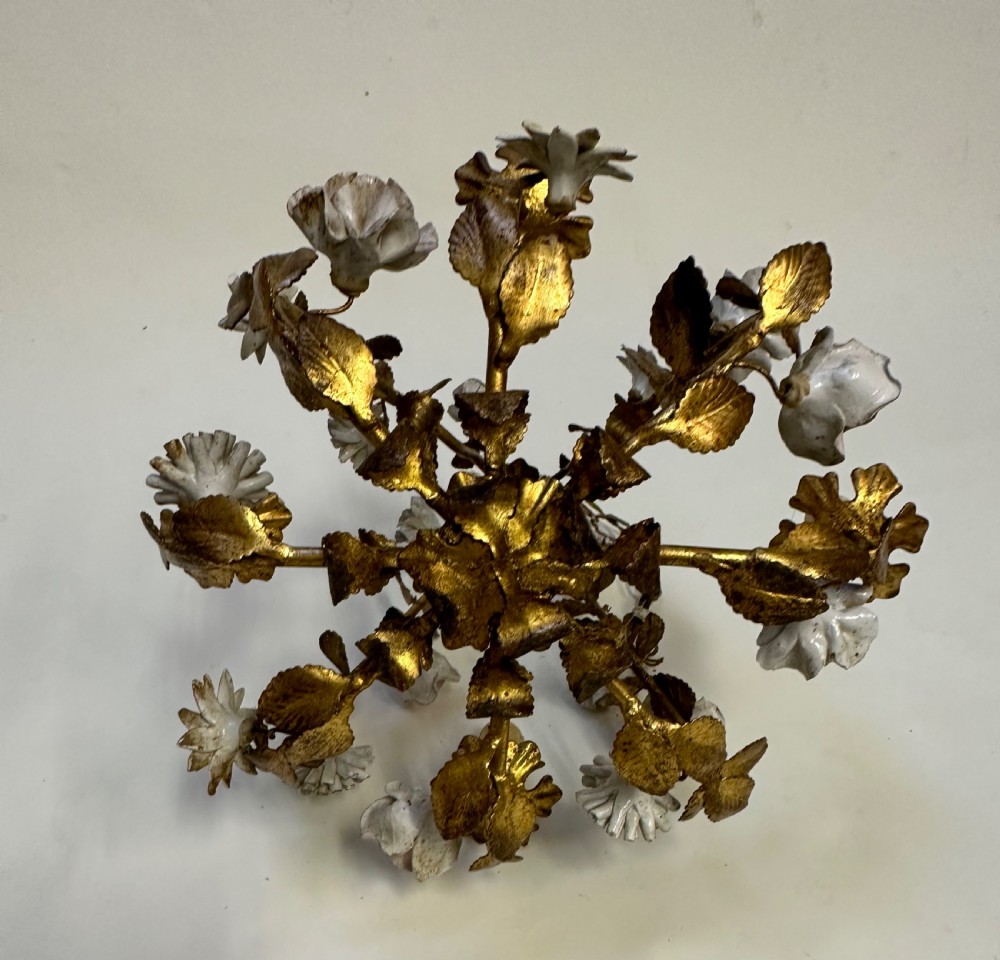 A French gilt metal cage chandelier decorated with multicoloured porcelain flowers and leaf motifs. View VII