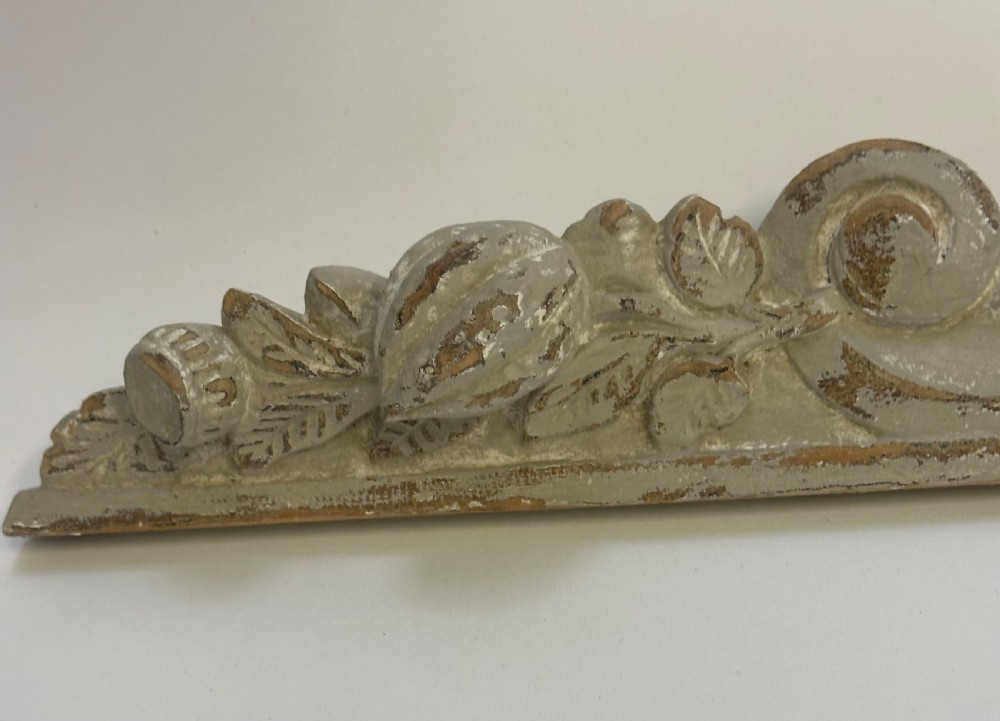 An antique French grey painted wooden pelmet featuring central hand-carved foliage and detailed scrollwork. View VI