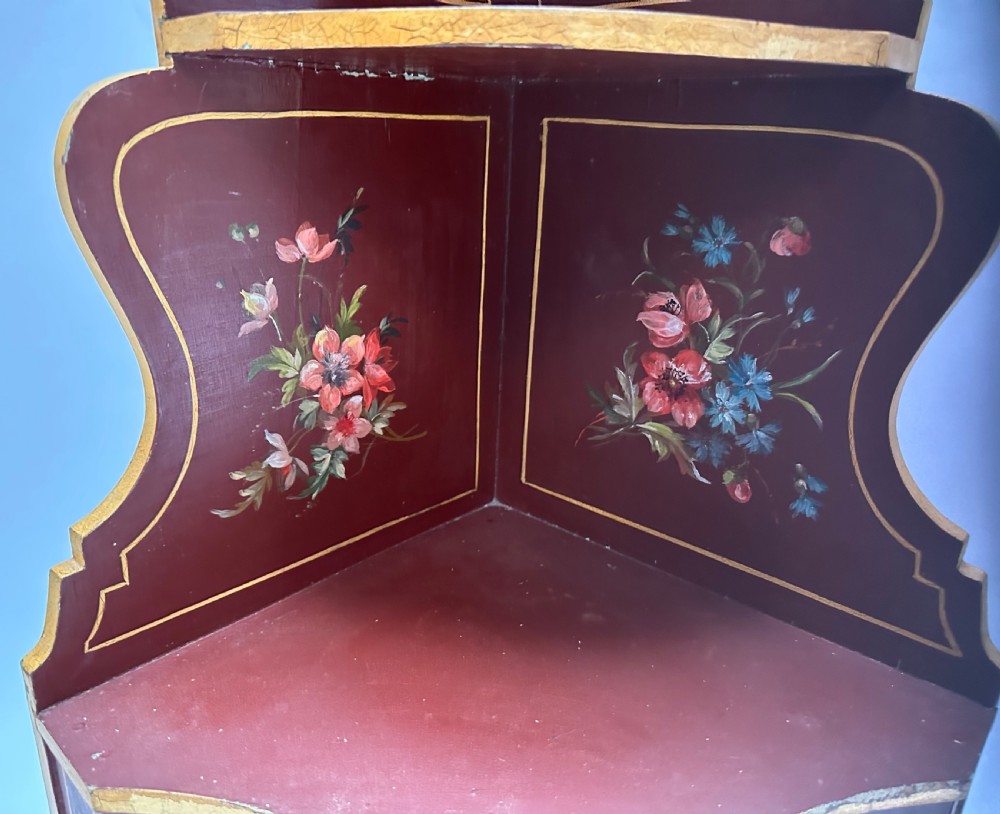 A matching pair of deep burgundy and gold painted Italian corner cupboards with upper open shelves and lower cabinet doors featuring hand-painted figures. View XI