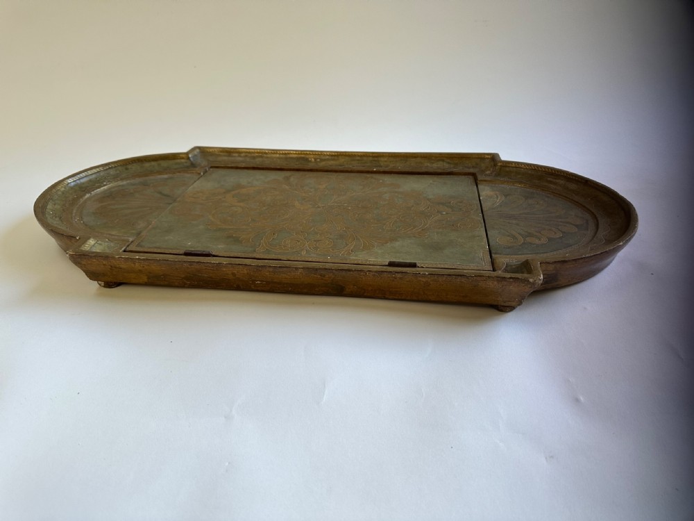 An antique Florentine painted and giltwood tabletop book stand with an open book resting on its angled surface. View VI