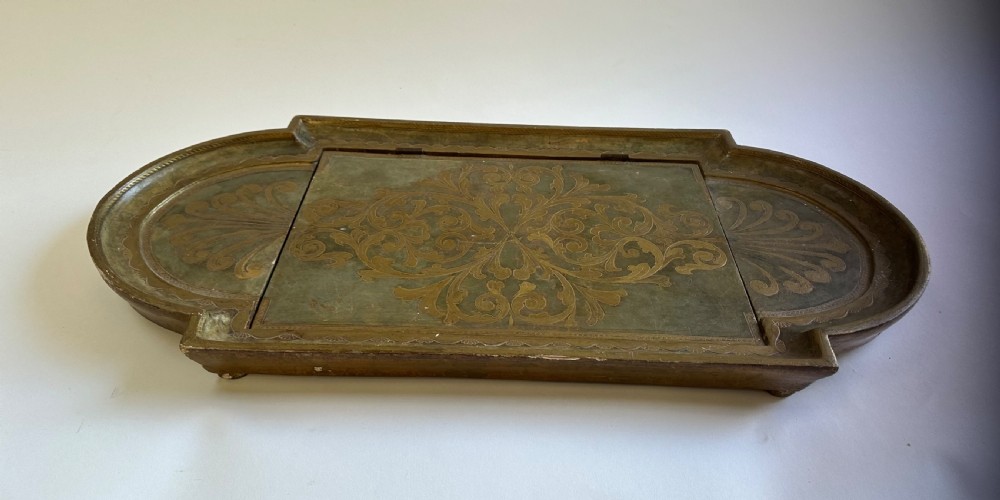 An antique Florentine painted and giltwood tabletop book stand with an open book resting on its angled surface. View VIII