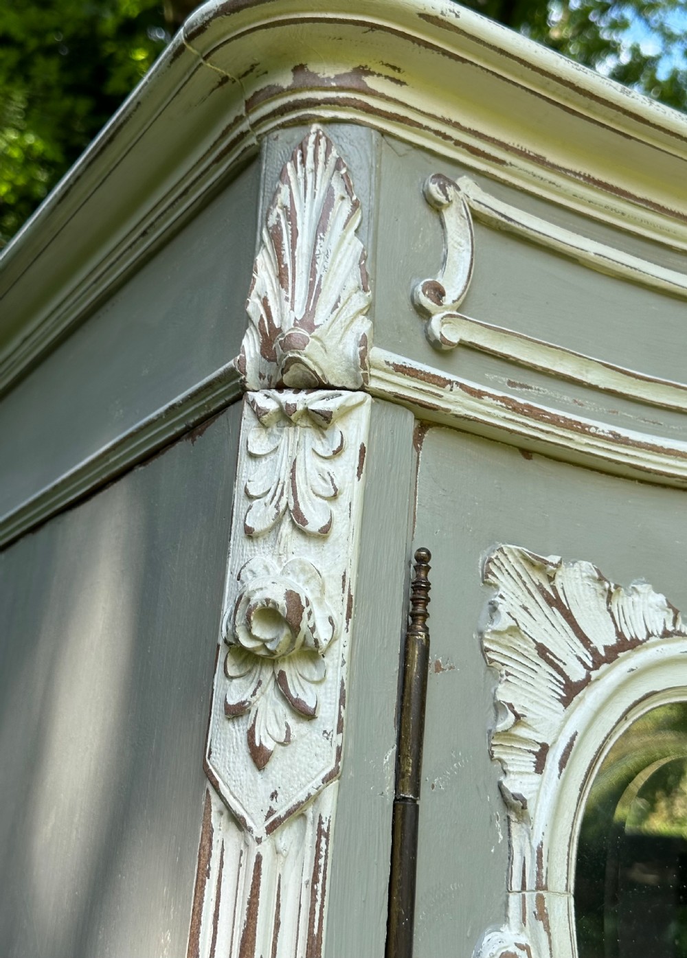 A grey and off-white painted French armoire featuring double mirrored doors and an ornate carved Rococo cresting. View V