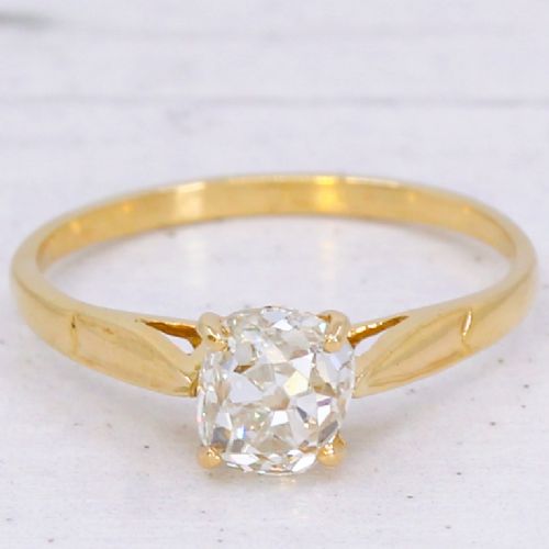 fig 2. An Edwardian yellow gold solitaire ring featuring a claw-set old cut diamond on a slender band.