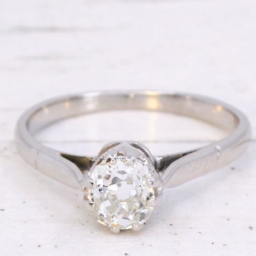 fig 2. A vintage silver-toned engagement ring featuring a single old cut diamond in a multi-claw setting.