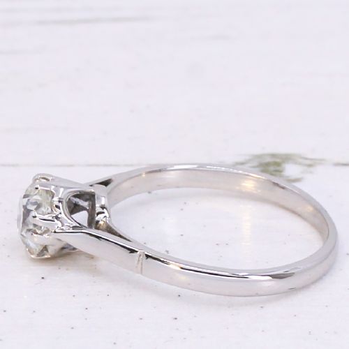 A vintage silver-toned engagement ring featuring a single old cut diamond in a multi-claw setting. View IV