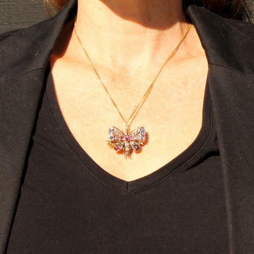 fig 2. A Victorian butterfly brooch set with rubies, sapphires, diamonds, and natural pearls in silver and gold.