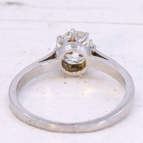 A solitaire ring featuring a 0.94-carat old-cut diamond mounted in a multi-claw setting on a polished silver-tone band. View V