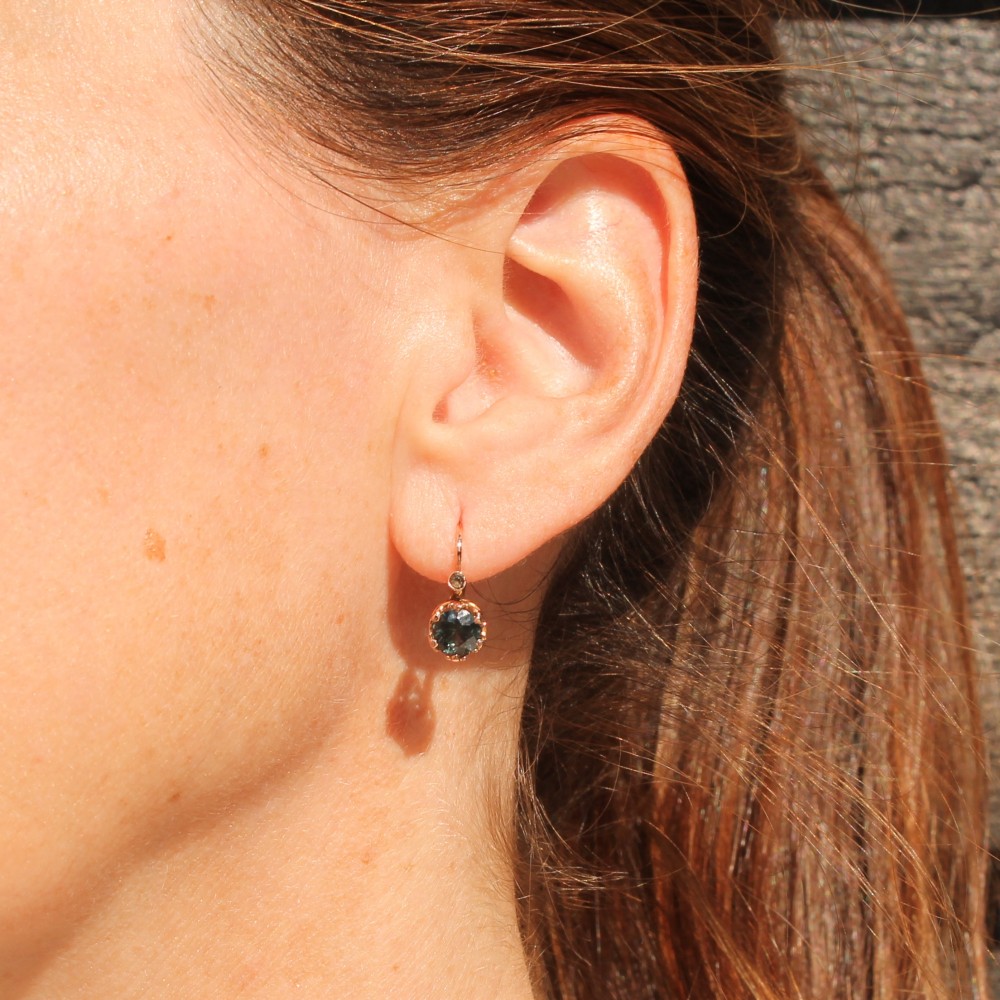 A pair of late Victorian rose gold drop earrings set with circular brilliant teal sapphires in crown claw mountings with leverback fittings. View II