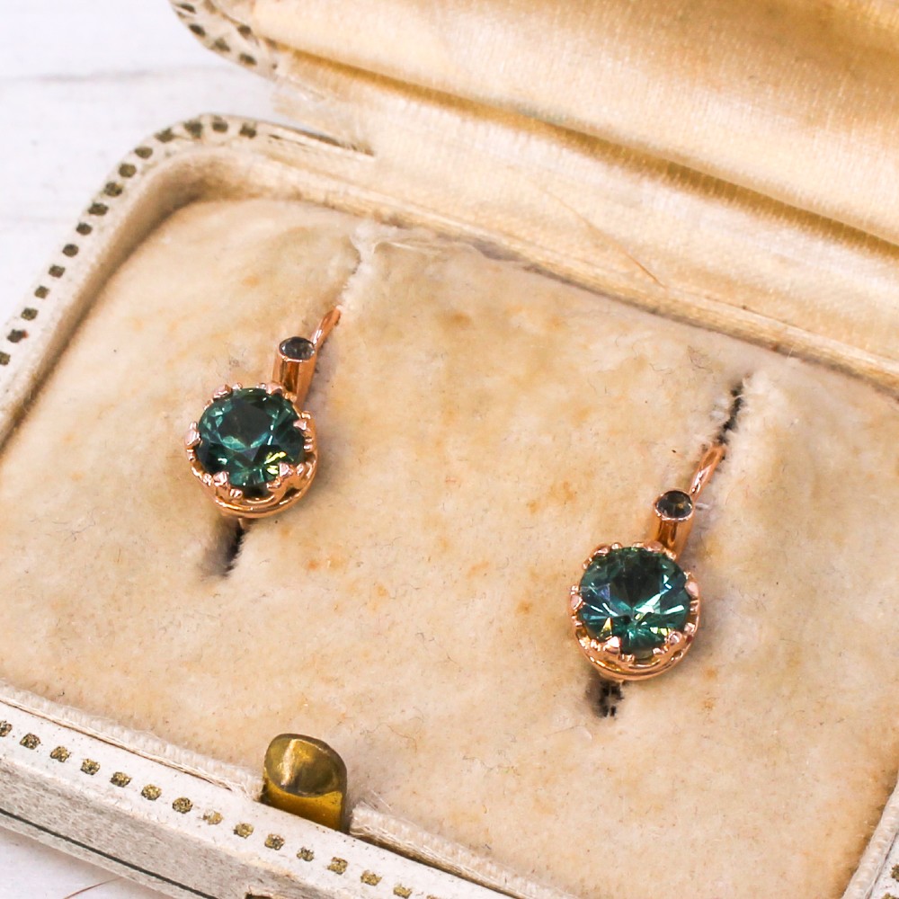 A pair of late Victorian rose gold drop earrings set with circular brilliant teal sapphires in crown claw mountings with leverback fittings. View III