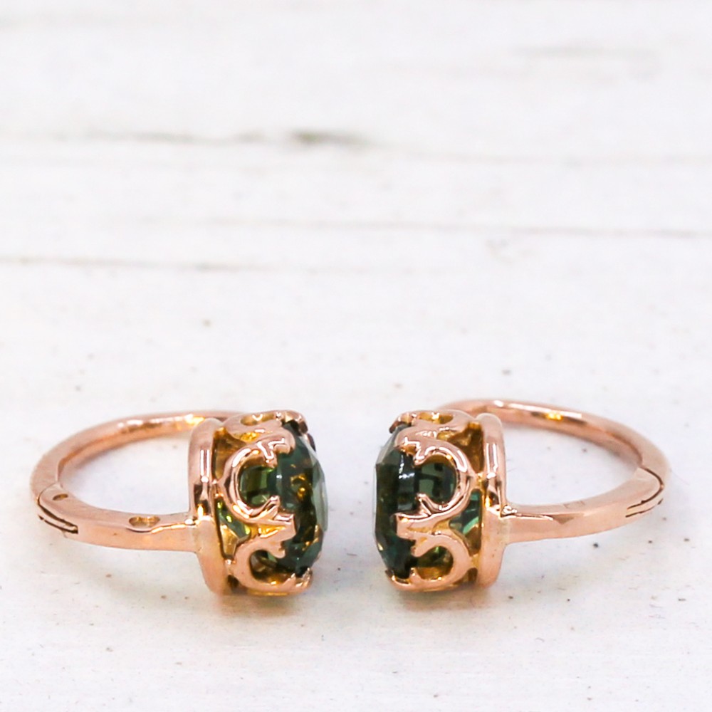A pair of late Victorian rose gold drop earrings set with circular brilliant teal sapphires in crown claw mountings with leverback fittings. View V
