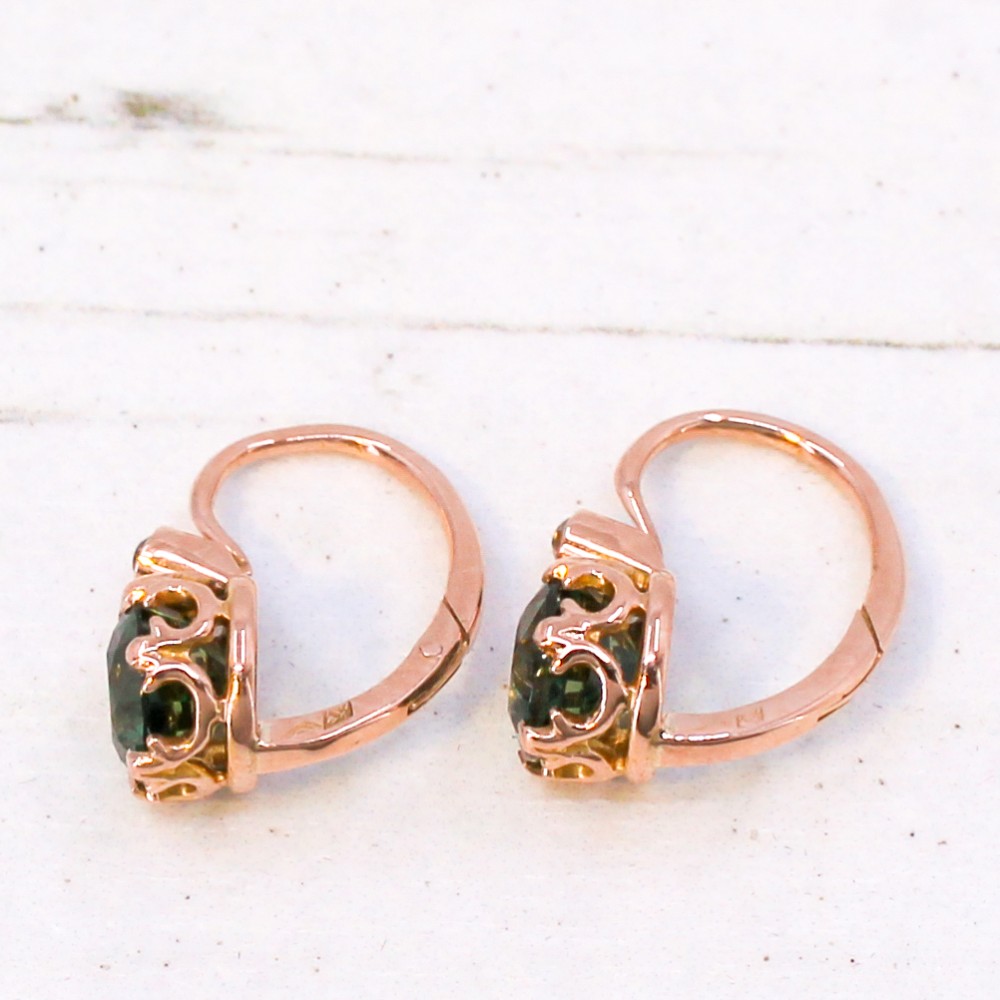 A pair of late Victorian rose gold drop earrings set with circular brilliant teal sapphires in crown claw mountings with leverback fittings. View VI