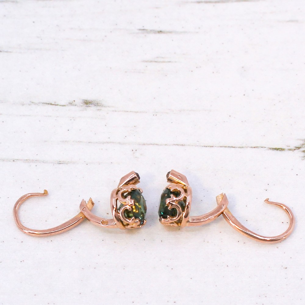 A pair of late Victorian rose gold drop earrings set with circular brilliant teal sapphires in crown claw mountings with leverback fittings. View VII