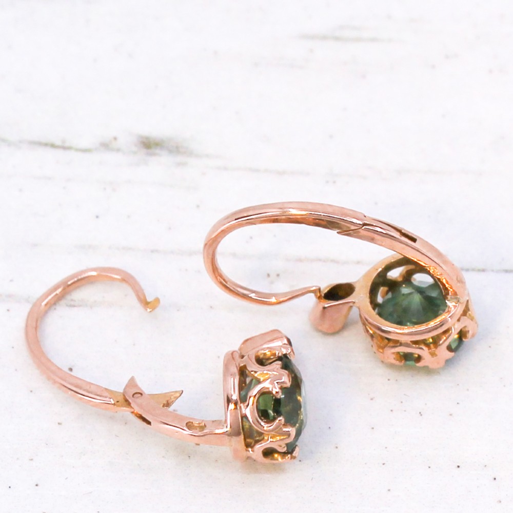 A pair of late Victorian rose gold drop earrings set with circular brilliant teal sapphires in crown claw mountings with leverback fittings. View VIII