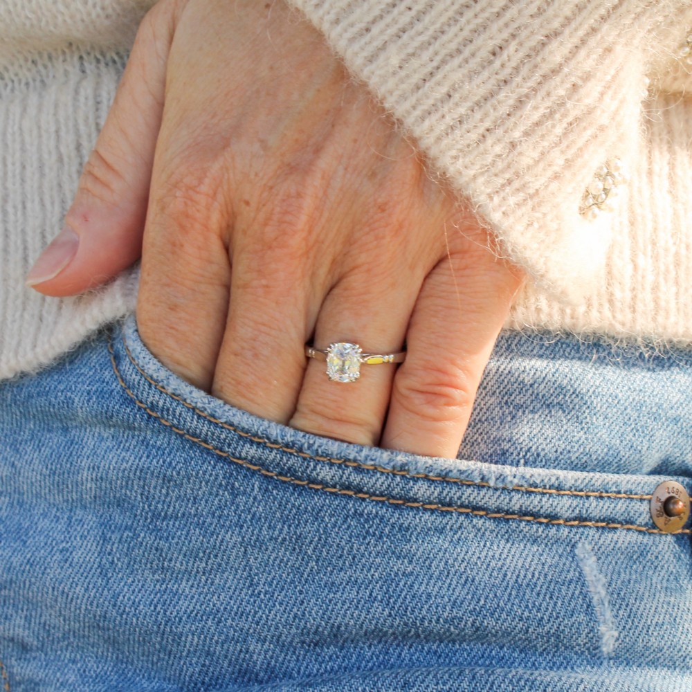 A platinum vintage ring featuring a central cushion-shaped old cut diamond held in a multi-claw setting with detailed shoulders. View II