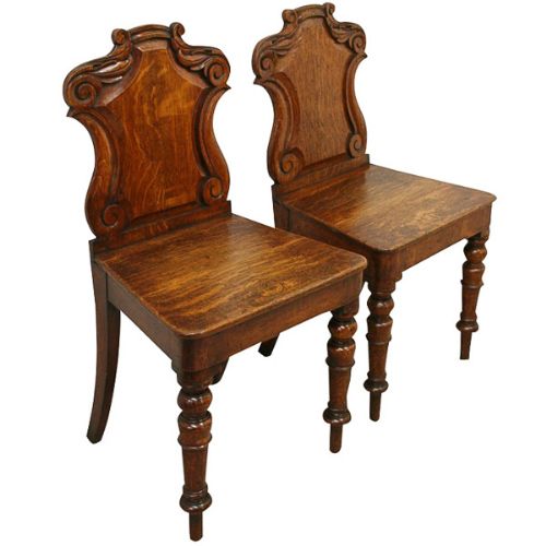 Pair of Early Victorian Carved Oak Hall Chairs