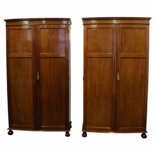 Pair of Georgian Style Bow Fronted Mahogany Wardrobes by Maple & Co