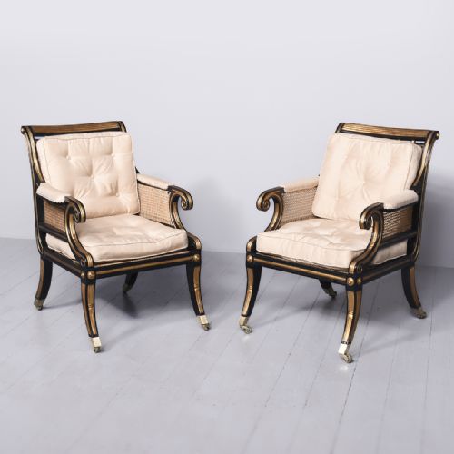 Rare Pair of Large Regency Cane Upholstered Gilt and Ebonized Bergère Chairs