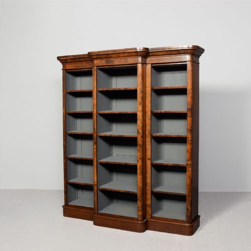 MIDVICTORIAN BURR WALNUT THREESECTION BREAKFRONT OPEN BOOKCASE WITH 5 ADJUSTABLE SHELVES
