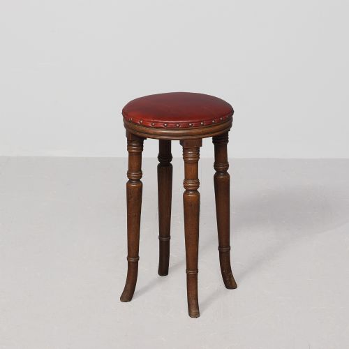 An unusual style mahogany circular George 3rd stool with leather upholstery