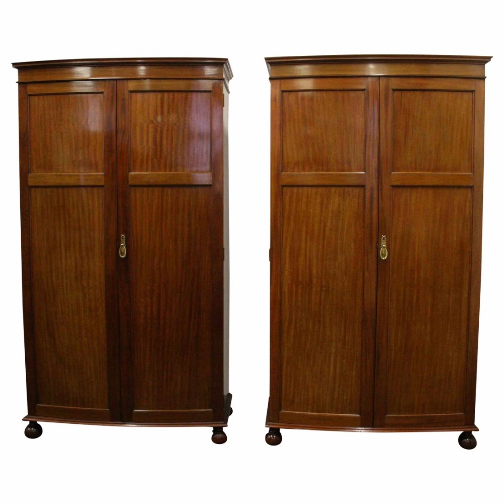 Pair of Georgian Style Bow Fronted Mahogany Wardrobes by Maple & Co