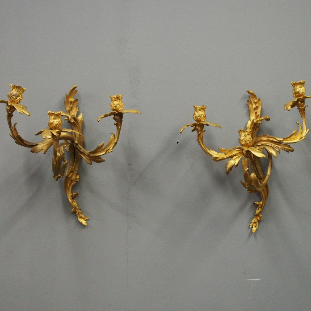 Pair of Louis XV Style Cast Brass and Gilded Sconces