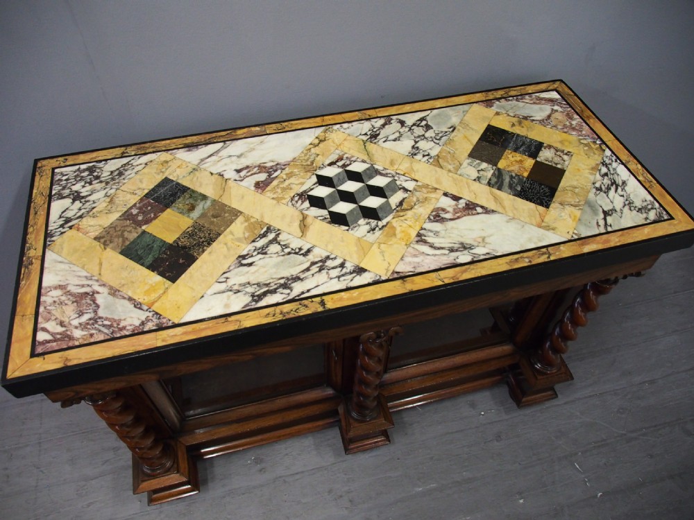 A dark William IV rosewood side cabinet featuring a geometric specimen marble top, barley twist support columns, and two glass door panels. View IV