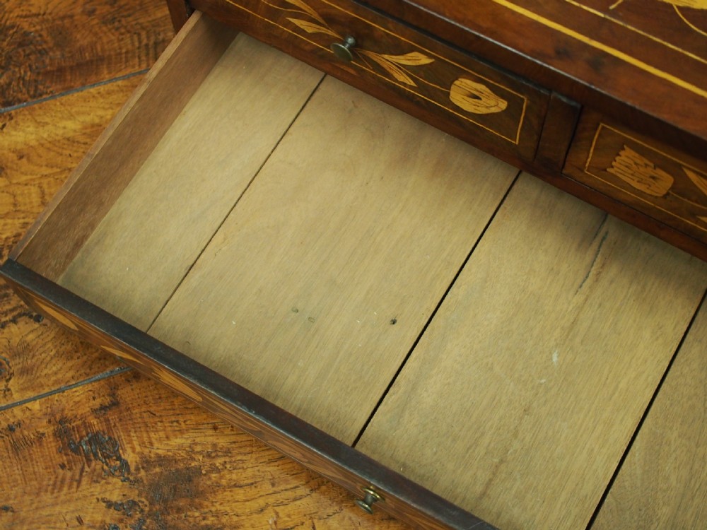 A Dutch marquetry toilet mirror with floral wood inlay, a pivoting rectangular frame, and a base featuring small drawers. View XVIII
