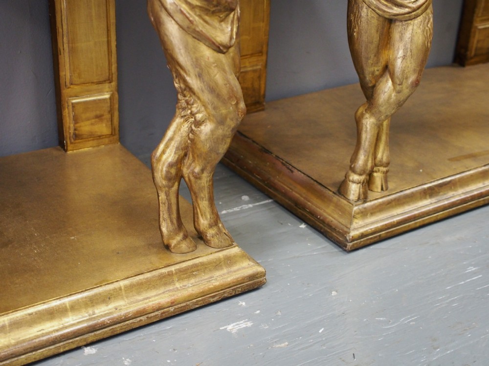 A pair of rectangular gilded console tables featuring carved mythological centaur figures supporting green marble tops. View VII