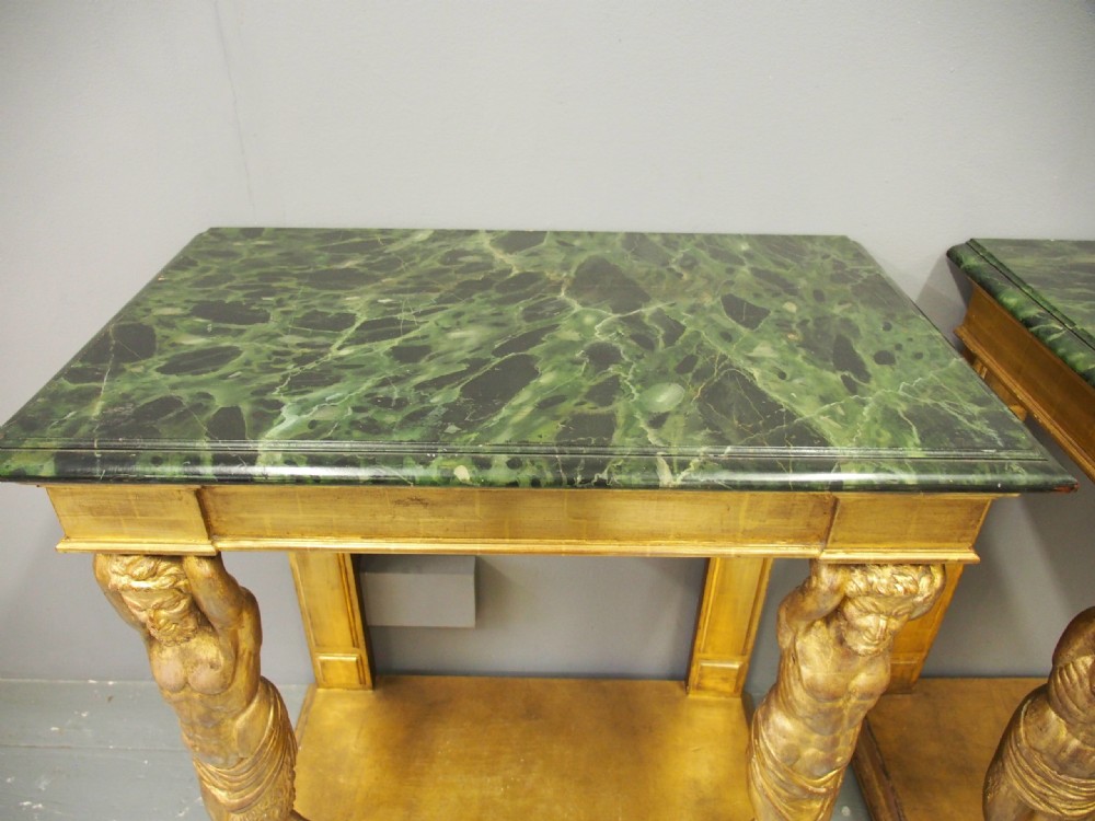 A pair of rectangular gilded console tables featuring carved mythological centaur figures supporting green marble tops. View XII