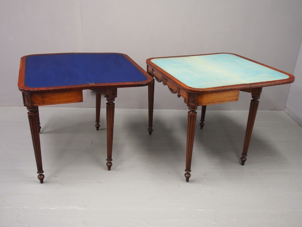 A pair of William IV mahogany foldover card tables featuring fluted legs, carved floral swags, and rectangular hinged tops. View XII