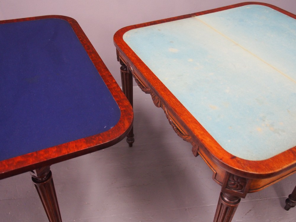 A pair of William IV mahogany foldover card tables featuring fluted legs, carved floral swags, and rectangular hinged tops. View XIV