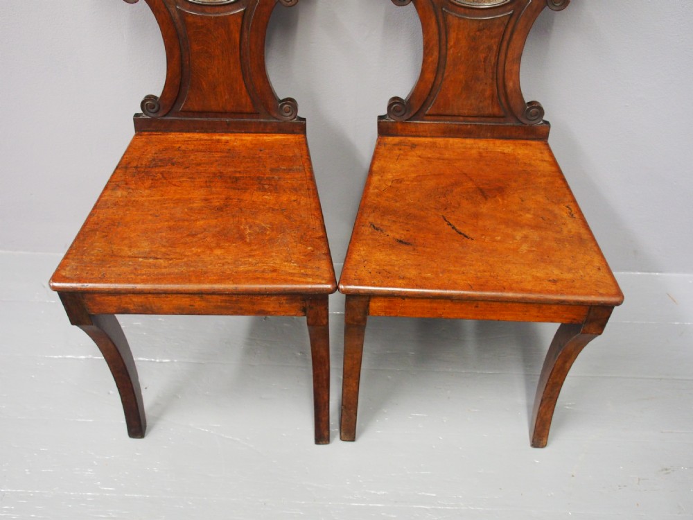 Pair of Regency Mahogany Hall Chairs with Painted Coronet View XVI
