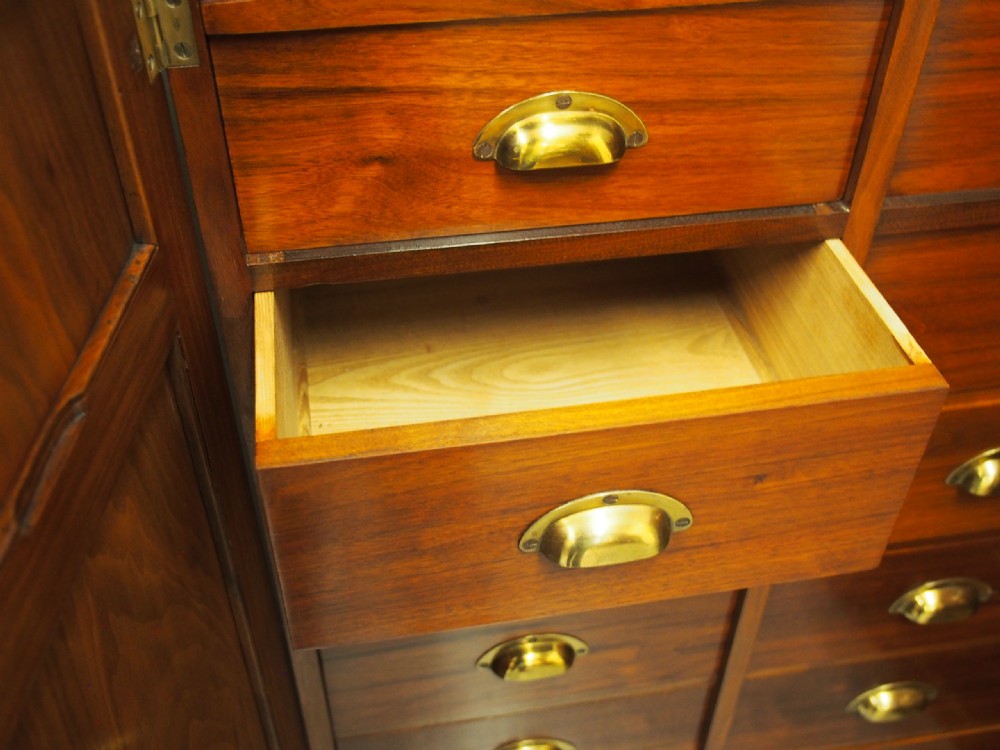 A pair of Victorian warm brown walnut collector cabinets featuring twin doors with decorative burr wood panels and internal fitted shallow drawers with brass cup handles. View IX