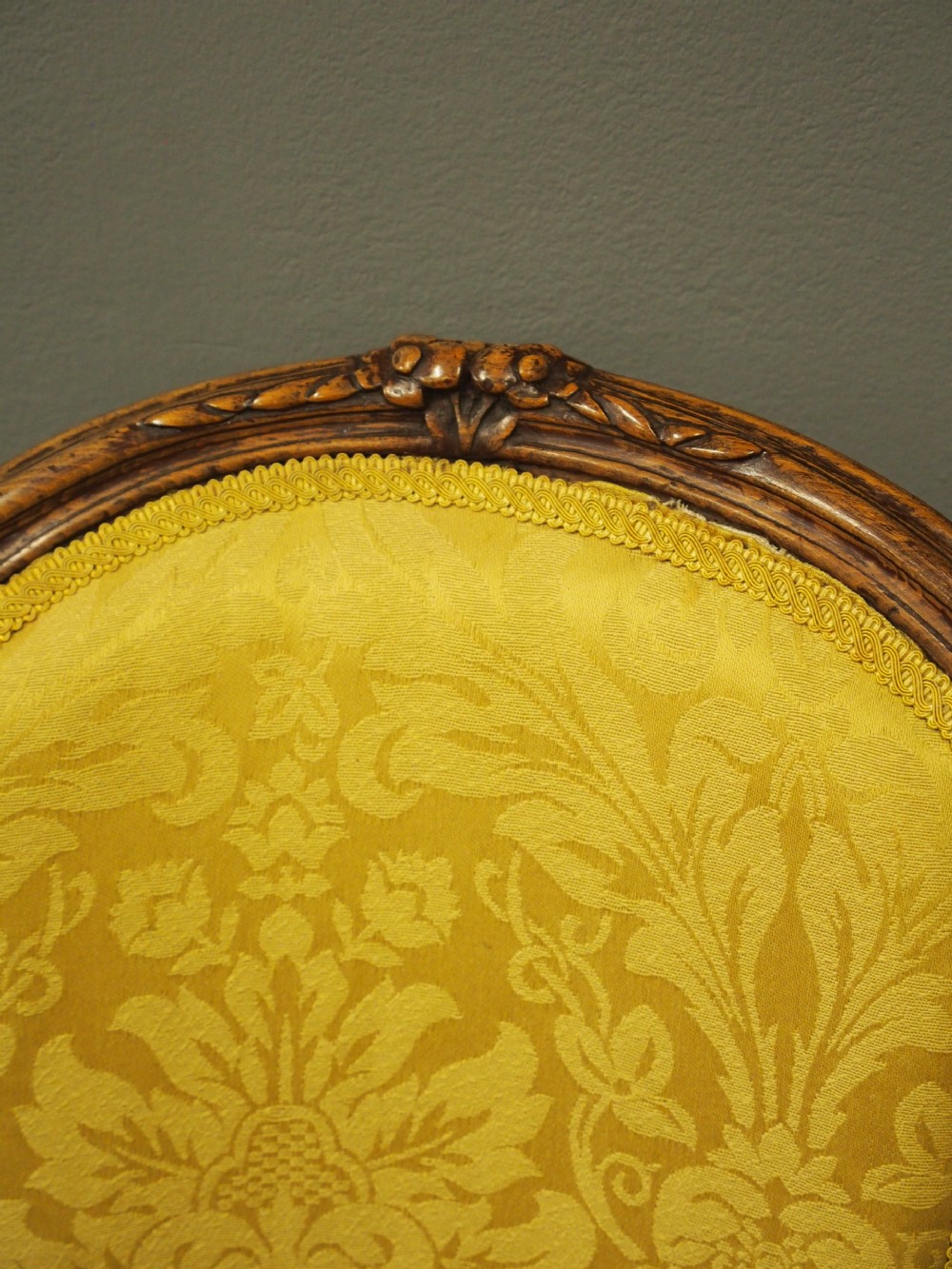 A pair of French Louis XV style armchairs featuring carved wooden frames, cabriole legs, and yellow patterned damask upholstery. View VI