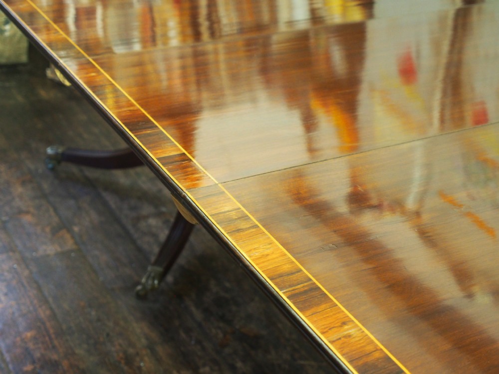 Regency Style Triple Pillar Mahogany and Rosewood Dining Table View II