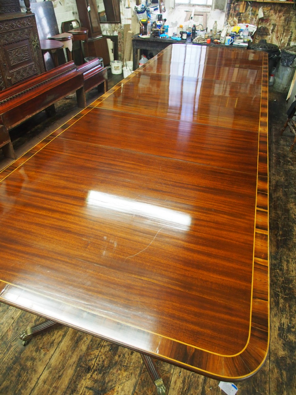 Regency Style Triple Pillar Mahogany and Rosewood Dining Table View VIII