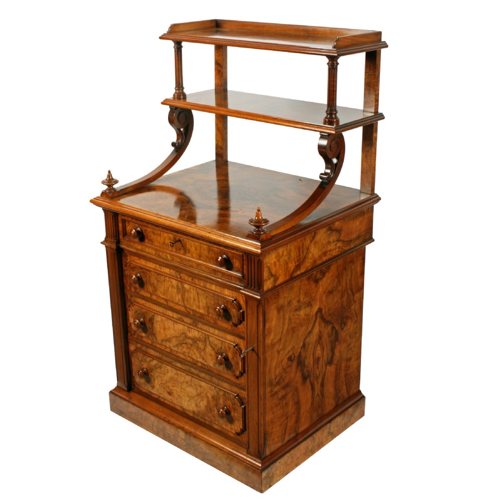 A mid-Victorian burr walnut writing desk featuring an upper superstructure with two open shelves supported by turned columns and scrolled side brackets above four drawers with turned wooden knobs. View II