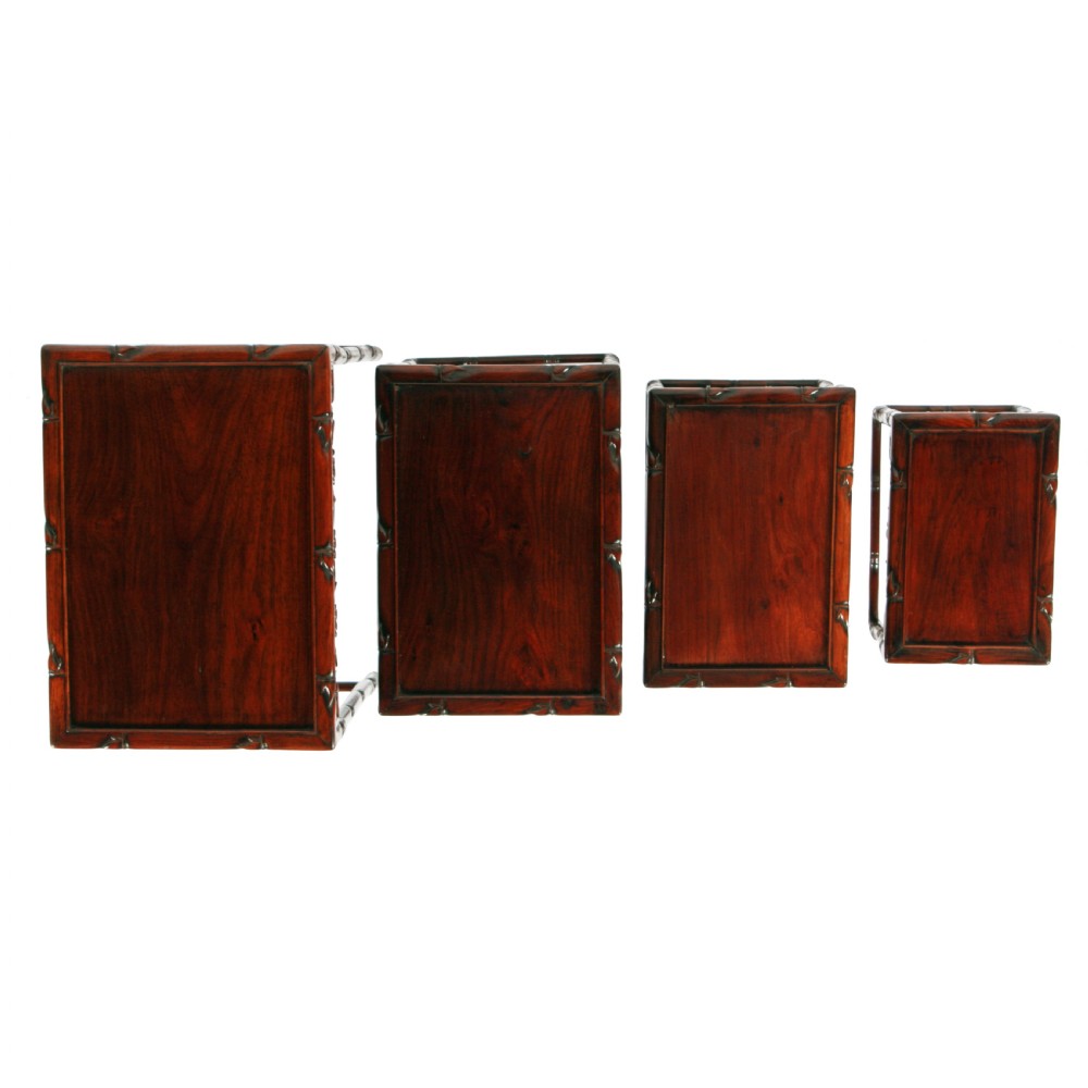 A set of four graduated dark brown Chinese hardwood nesting tables featuring faux-bamboo carved legs and pierced openwork aprons. View III