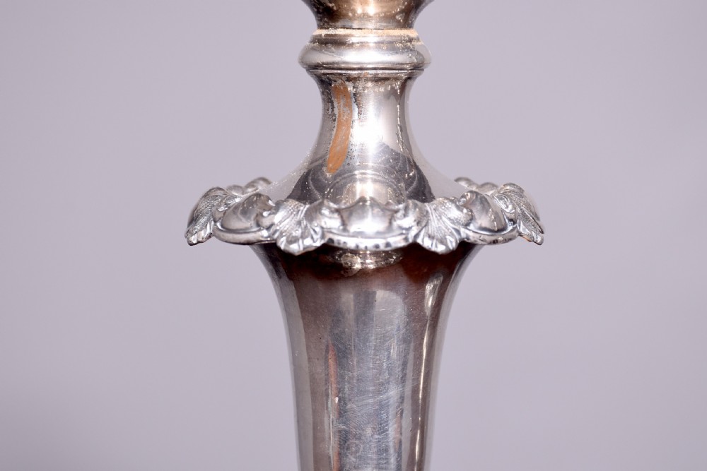 A pair of antique silver-plated three-light candelabra featuring circular bases, baluster stems, and curved reeded branches. View III