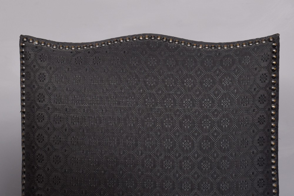 A set of four George III style side chairs upholstered in dark grey patterned fabric with brass stud trimming and straight mahogany legs. View IV