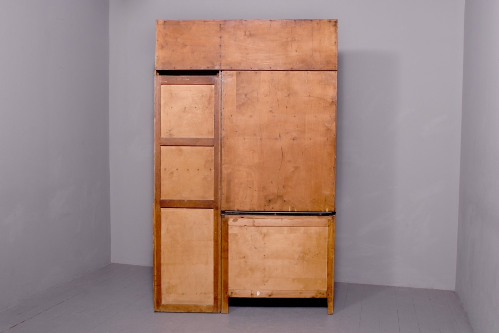 A tall oak Easiwork kitchen cabinet featuring multiple storage cupboards, drawers, an integrated enamel work surface, and an internal flour sifter mechanism. View II