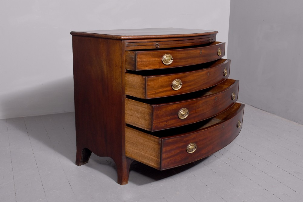 Neat size George 3rd mahogany bow - front chest of drawers with brushing slide and great colour and patina View VI