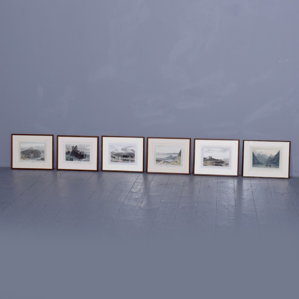 A row of six framed antique Regency landscape prints featuring topographical scenes framed in brown wood with cream mounts. View II