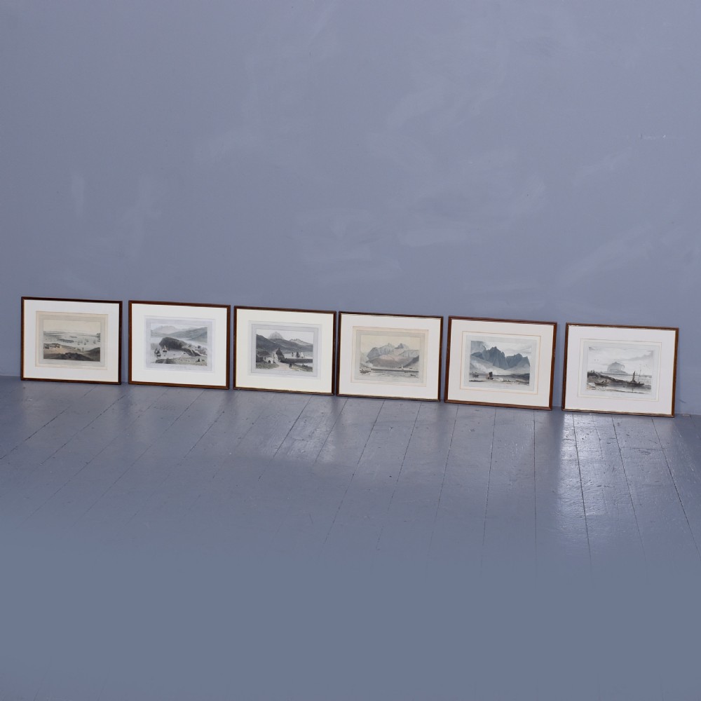 A row of six framed antique Regency landscape prints featuring topographical scenes framed in brown wood with cream mounts. View XXIV