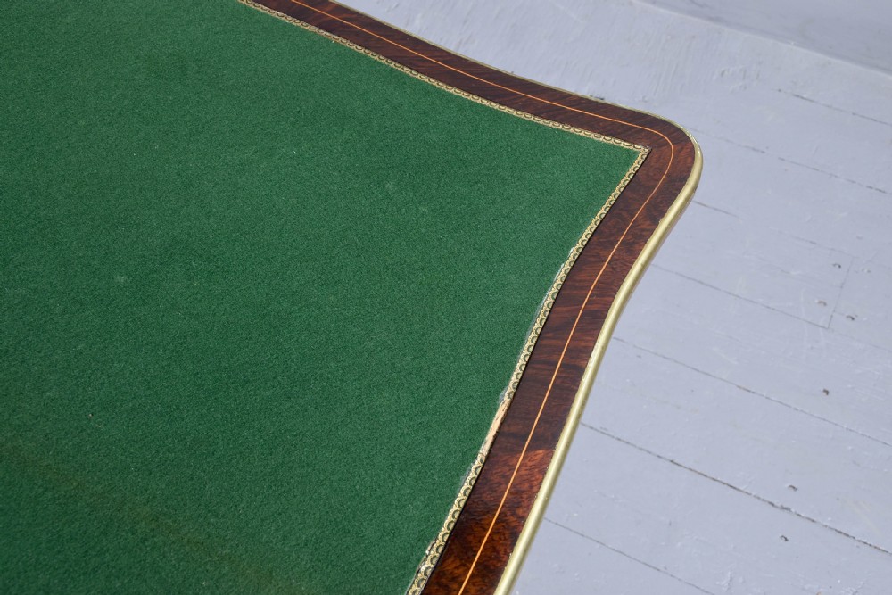 A Louis XV style French fold-over card table featuring warm brown veneer with floral marquetry inlay, cabriole legs, and gilt-bronze mounts. View VII