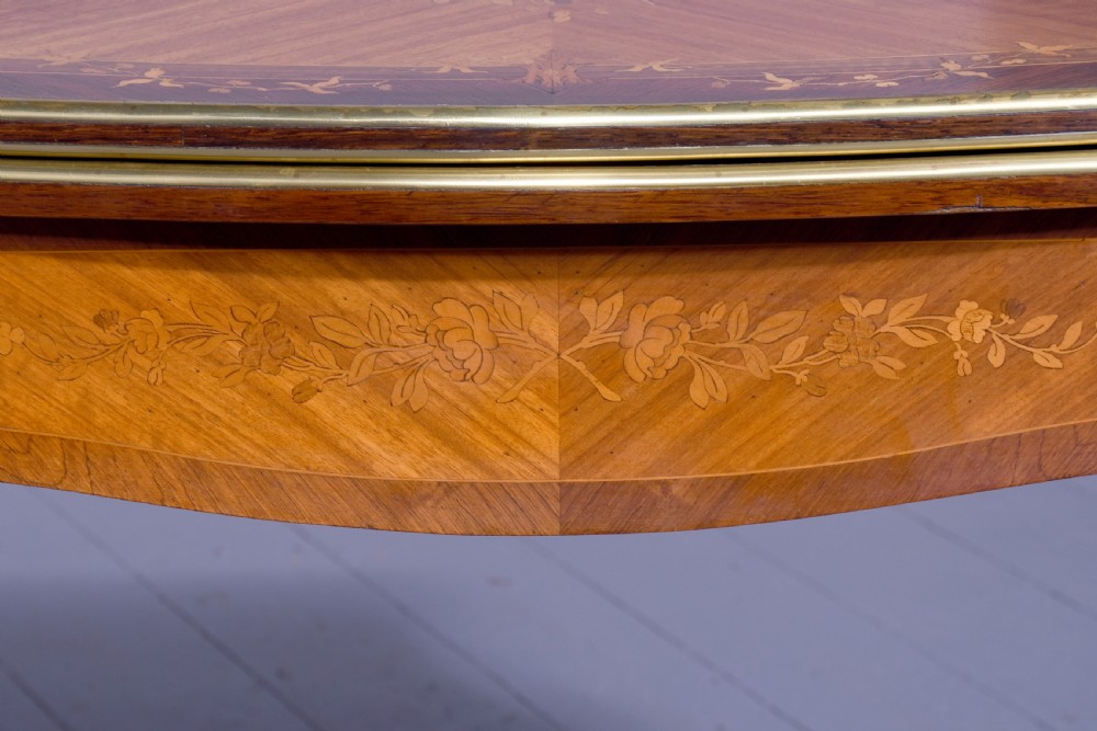 A Louis XV style French fold-over card table featuring warm brown veneer with floral marquetry inlay, cabriole legs, and gilt-bronze mounts. View XIII