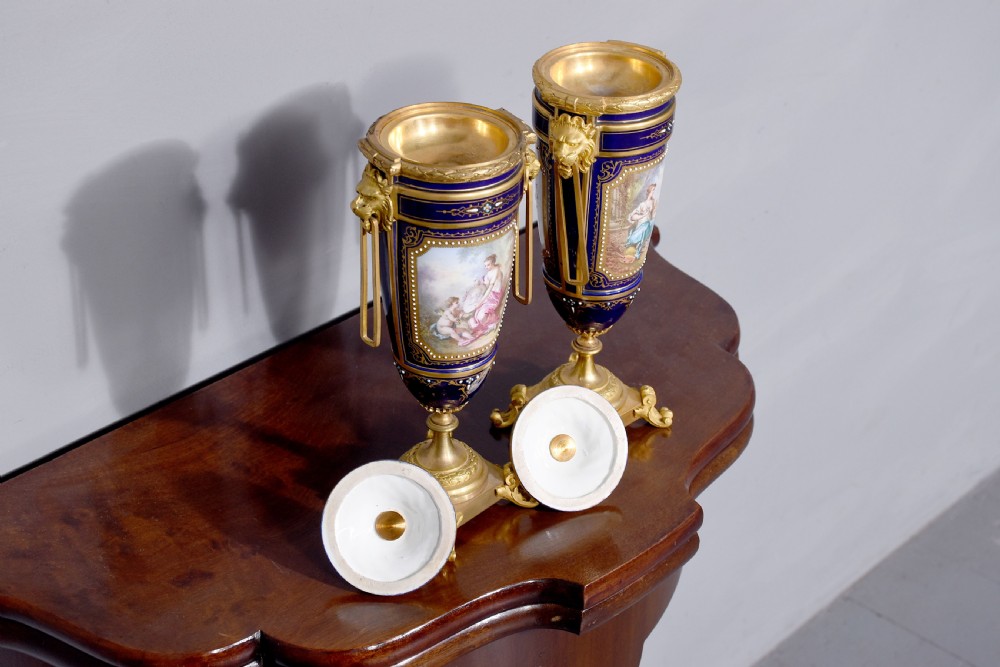 Pair of Sevres or Sevres style hand - decorated cobalt blue porcelain vases with ormolu mounts View III