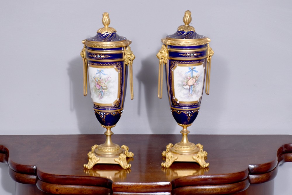 Pair of Sevres or Sevres style hand - decorated cobalt blue porcelain vases with ormolu mounts View IV