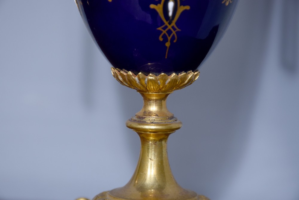 Pair of Sevres or Sevres style hand - decorated cobalt blue porcelain vases with ormolu mounts View V