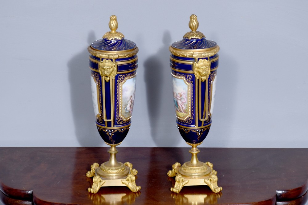 Pair of Sevres or Sevres style hand - decorated cobalt blue porcelain vases with ormolu mounts View IX